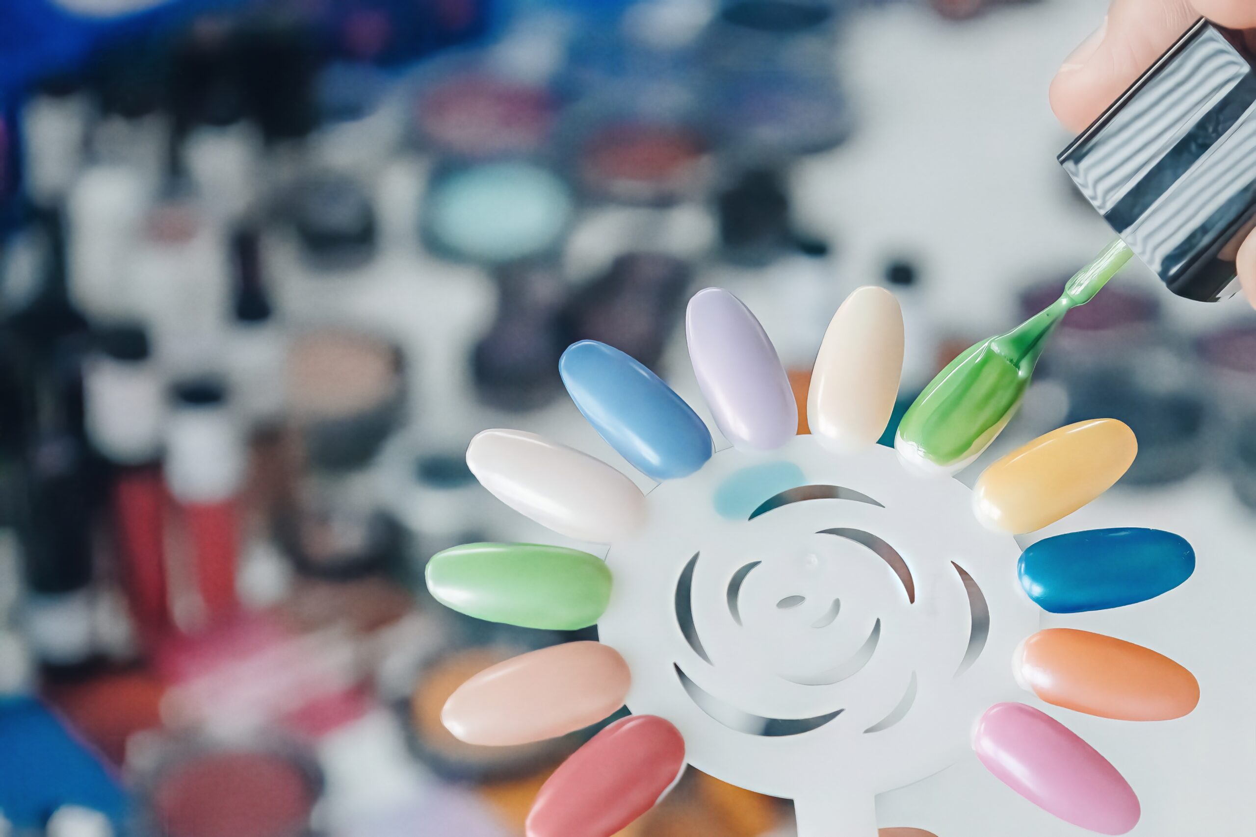 Plastic nails coated with various nail polishes formulated with ECKART effect pigments