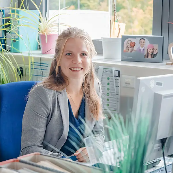 Cosmetic specialist working at her desk