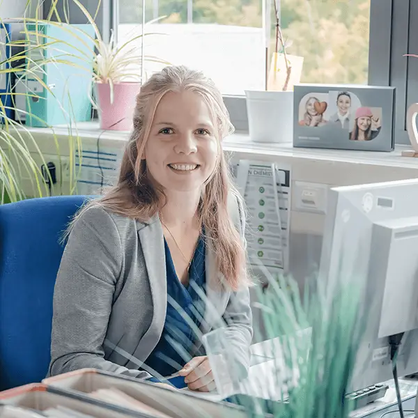 Cosmetic chemist working at desk